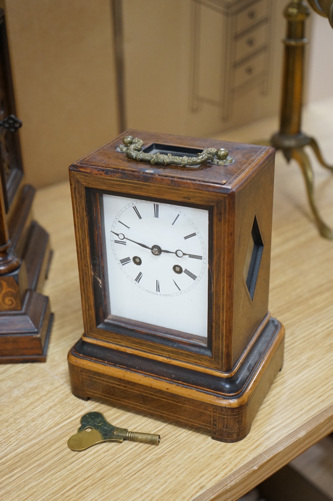 A rosewood mantel clock with French silk suspension movement, together with an Edwardian marquetry bracket clock signed to the dial S.Smith and son, Strand, London with a two train German movement striking on two coiled